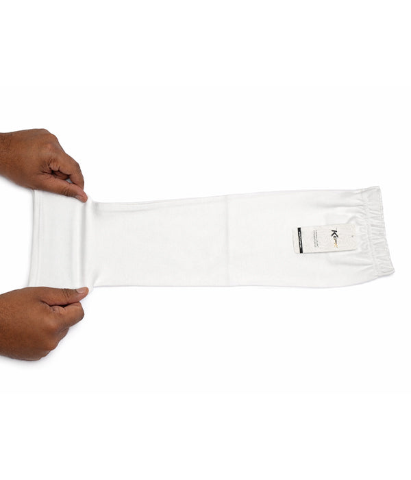 White sleeve extenders being held by a person on a white background