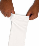 Person holding a white sleeve extender with a plain background