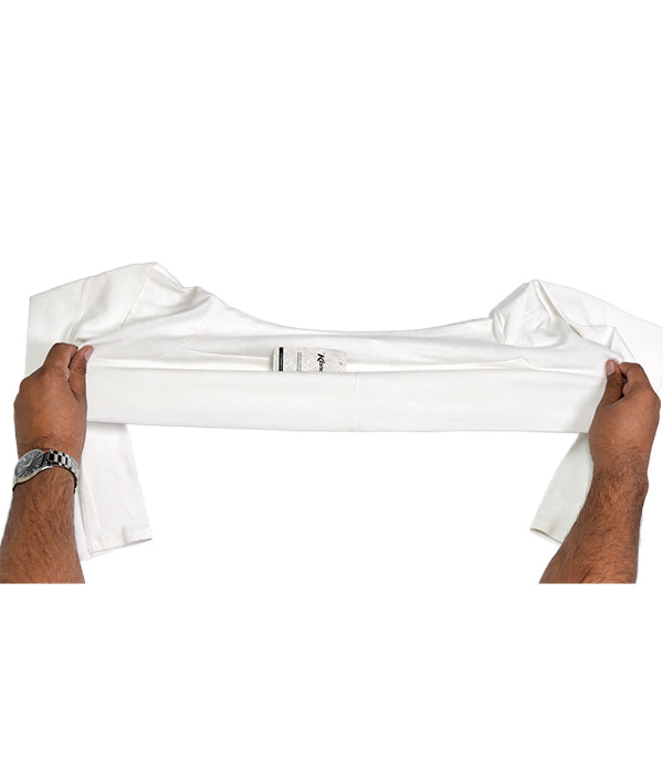 White sleeve extender being held by hands on a white background